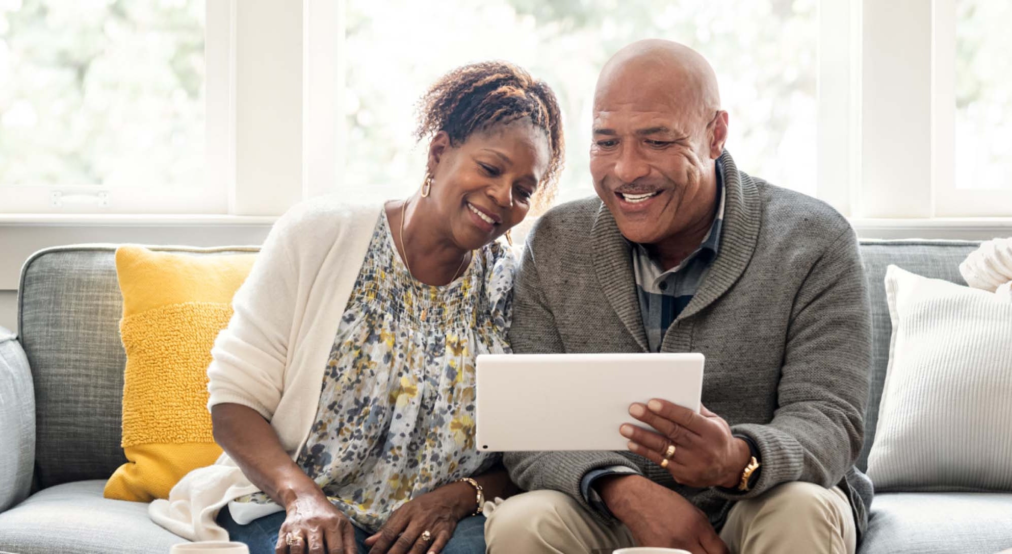 Smiley couple reading a plan