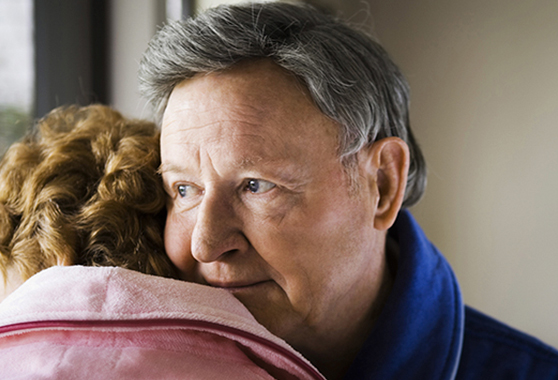 Old woman and man hugging
